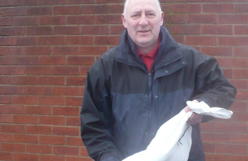 Anthony Bevington collecting sandbags