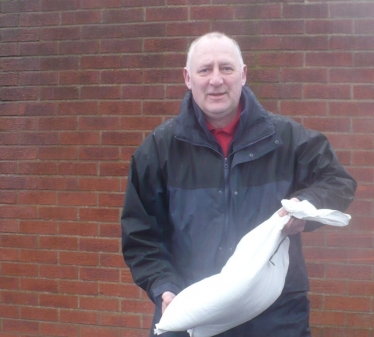 Anthony Bevington collecting sandbags